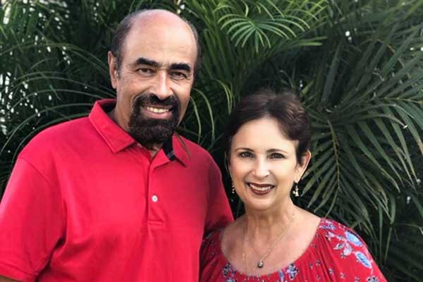 Pastors Harold and Christine Kilborn of The Church at Koloa standing together outdoors on Kauai.